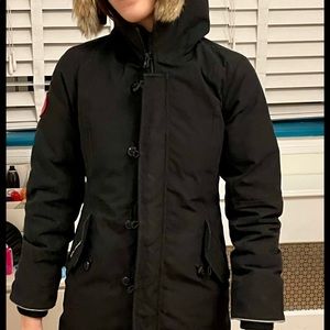 Good condition Mid length Canada goose coat. Girls size 12. Color black